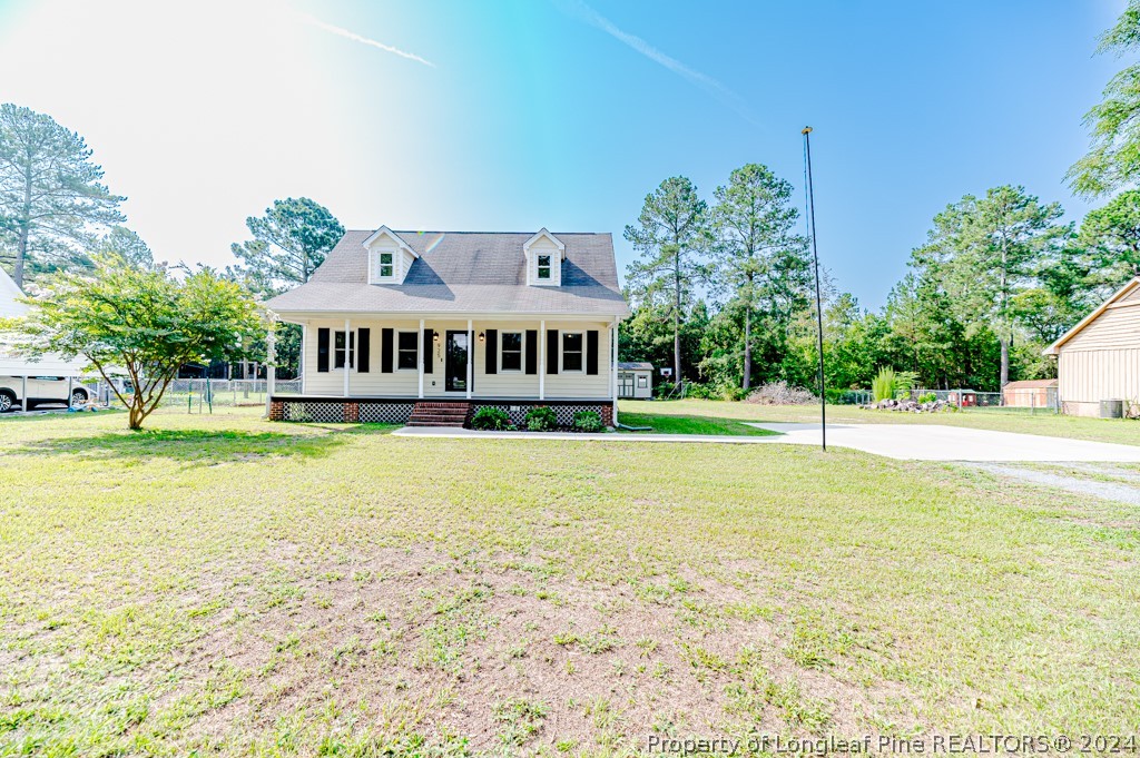 925 Line Road Cameron, NC 28326 - Photo 32 of 42 a view of swimming pool with lawn chairs and plants