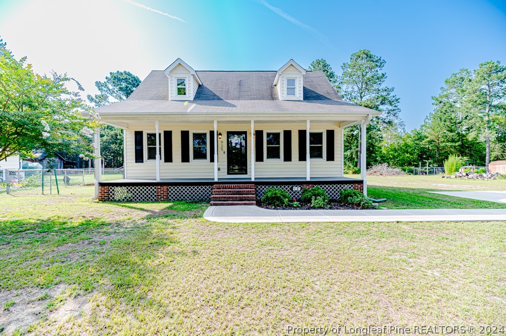 925 Line Road Cameron, NC 28326 - Photo 33 of 42 a front view of a house with garden