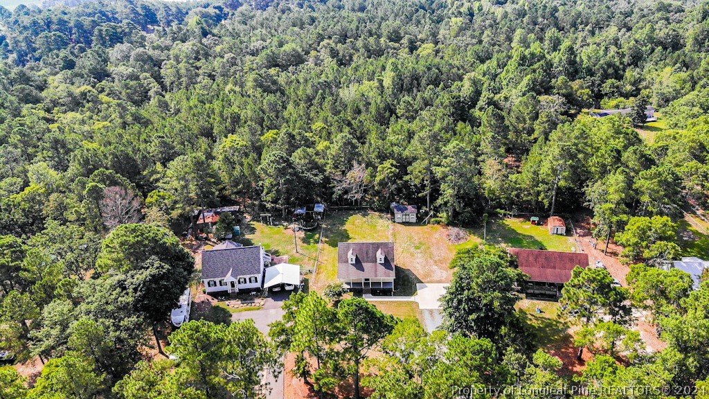 925 Line Road Cameron, NC 28326 - Photo 40 of 42 an aerial view of house with yard swimming pool and outdoor seating