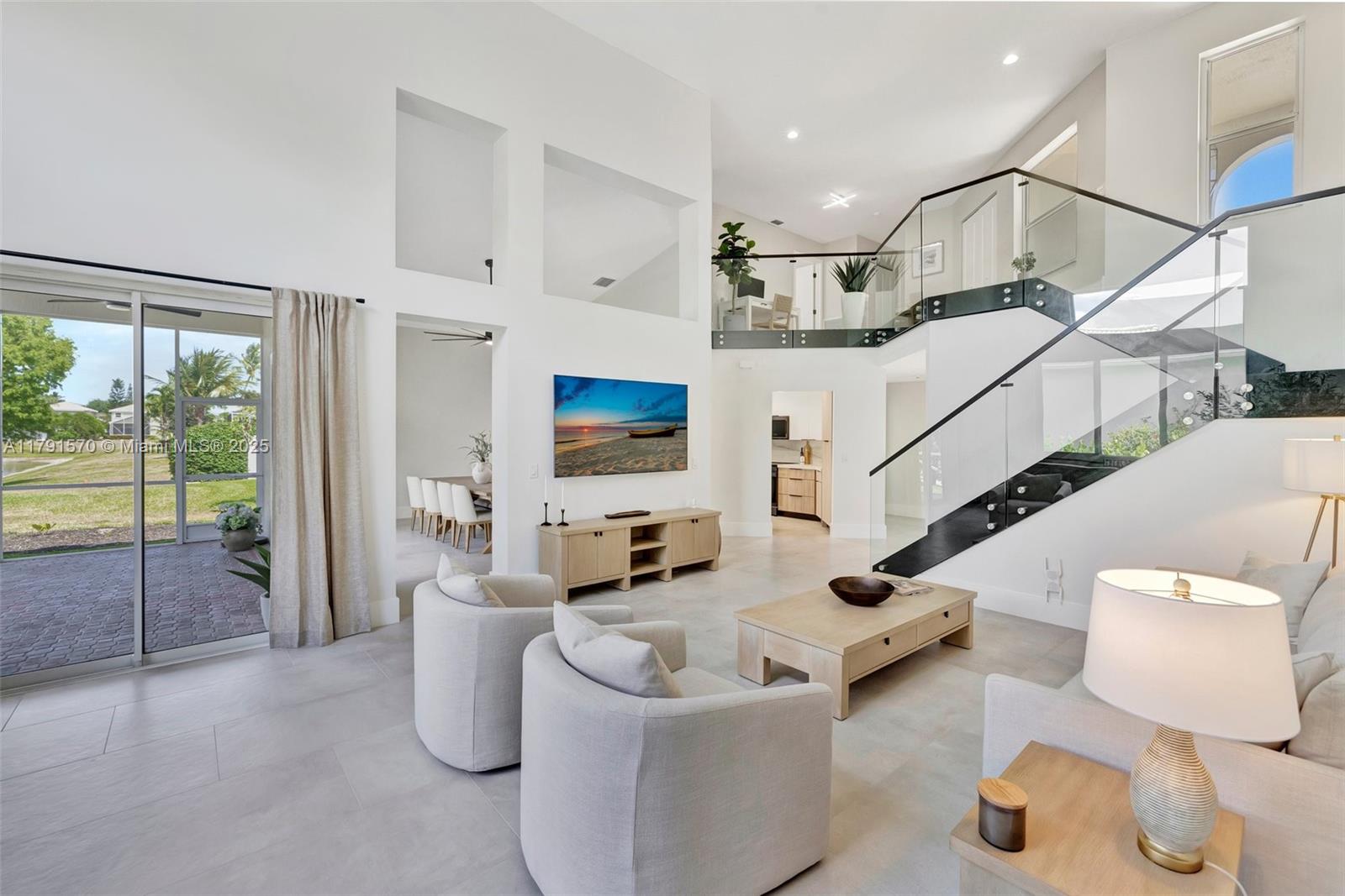 6393 Brava Way Boca Raton, FL 33433 - Photo 12 of 55 a living room with furniture and a large window