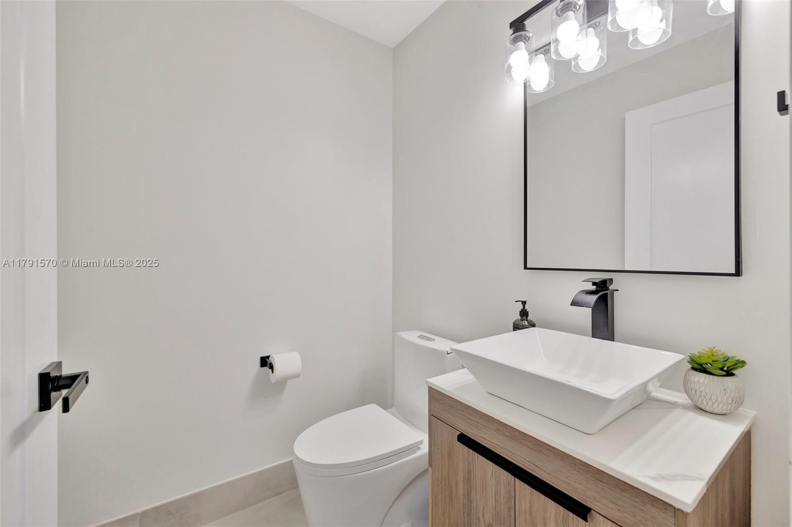 6393 Brava Way Boca Raton, FL 33433 - Photo 15 of 55 a bathroom with a sink vanity granite and toilet