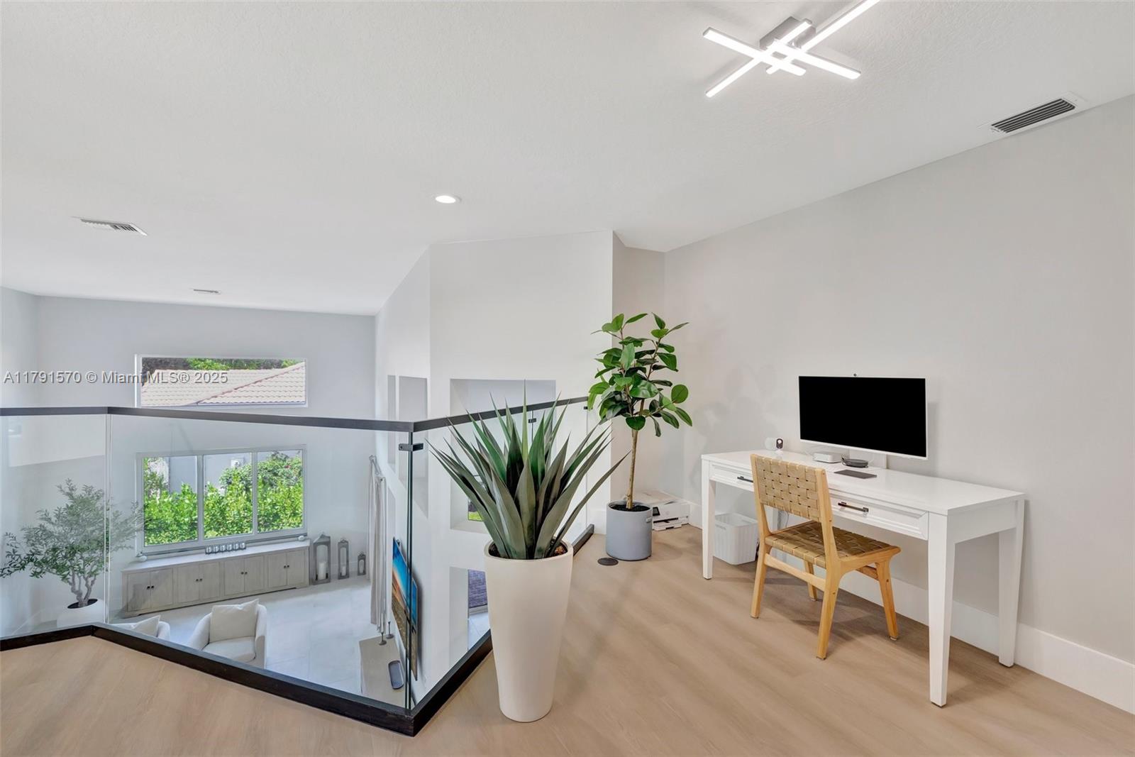 6393 Brava Way Boca Raton, FL 33433 - Photo 24 of 55 a view of a livingroom with furniture and a potted plant