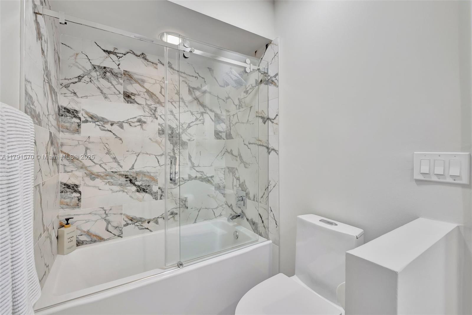 6393 Brava Way Boca Raton, FL 33433 - Photo 29 of 55 a bathroom with a bathtub and shower