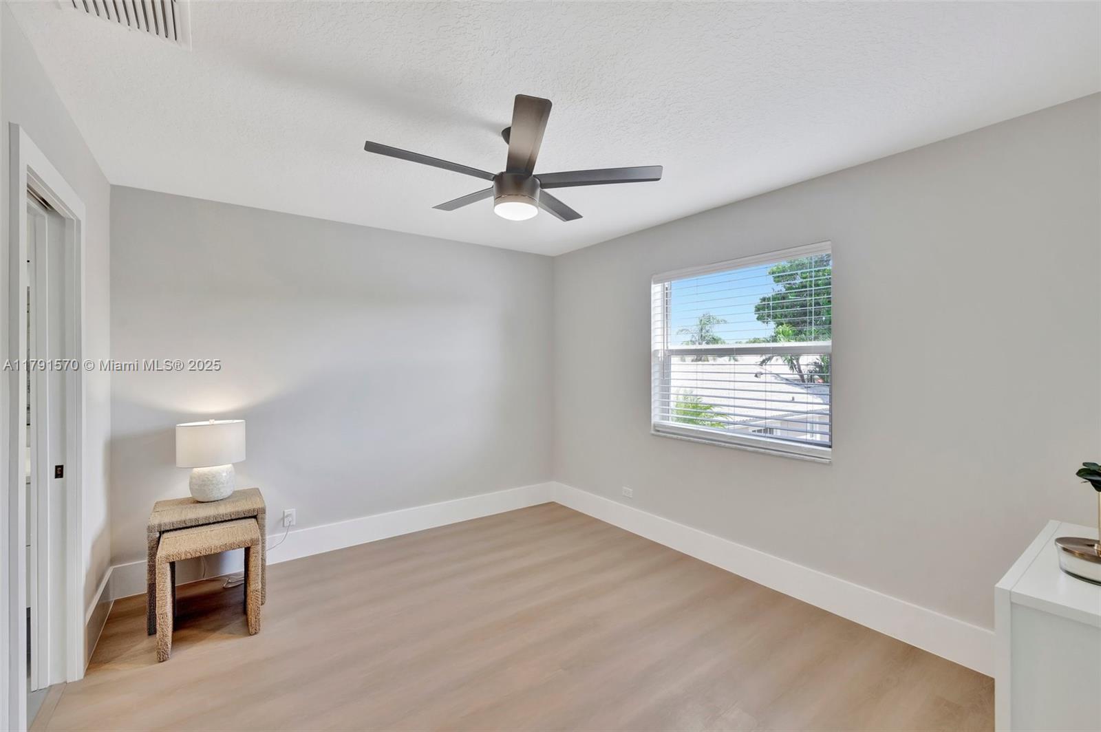 6393 Brava Way Boca Raton, FL 33433 - Photo 30 of 55 a view of an empty room with a window
