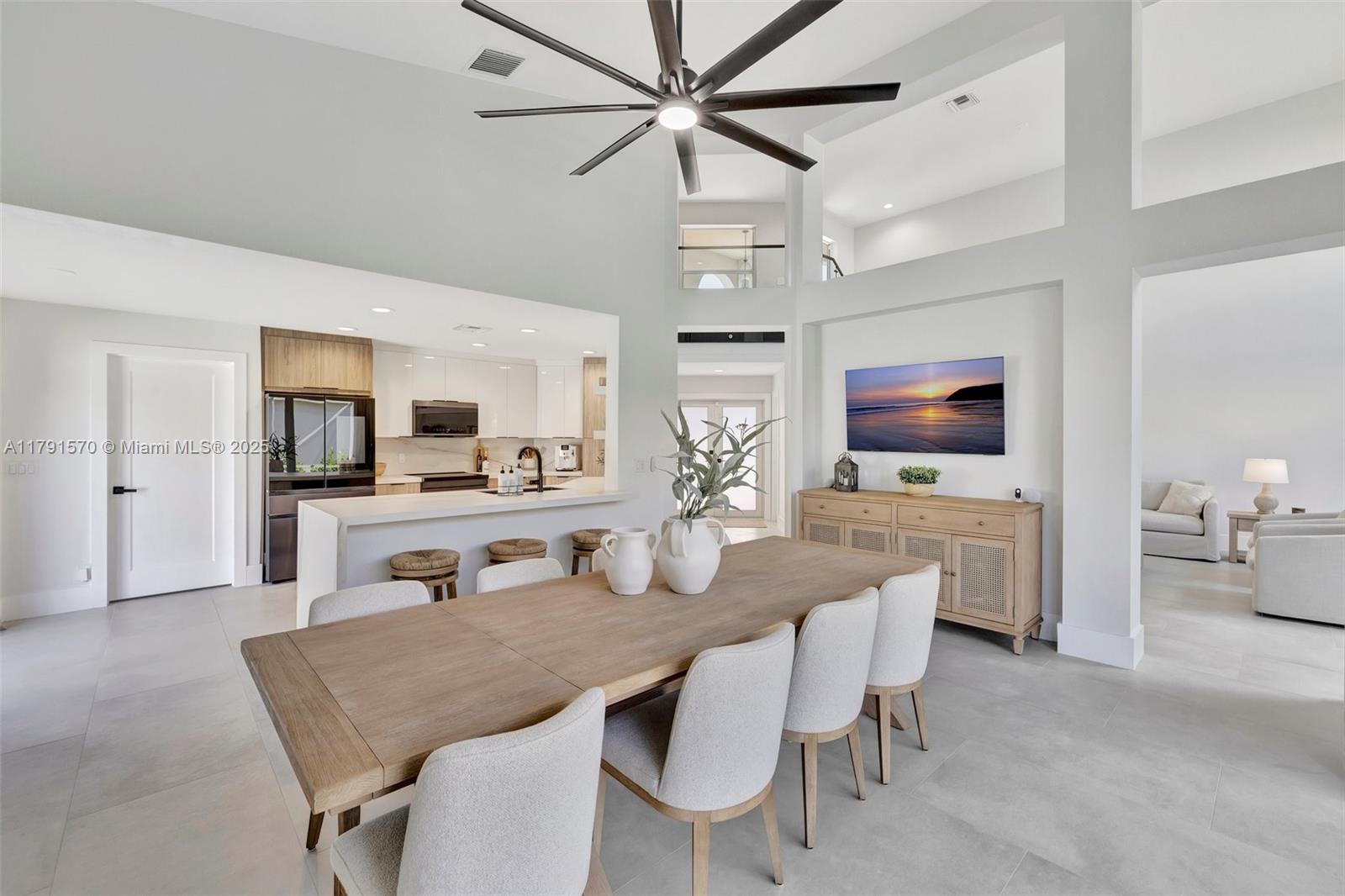 6393 Brava Way Boca Raton, FL 33433 - Photo 3 of 55 a view of a dining room with furniture and a chandelier