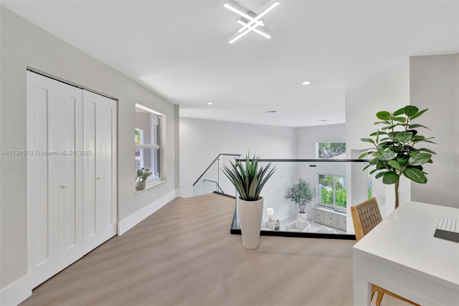 6393 Brava Way Boca Raton, FL 33433 - Photo 33 of 55 a view of living room filled with furniture and a potted plant