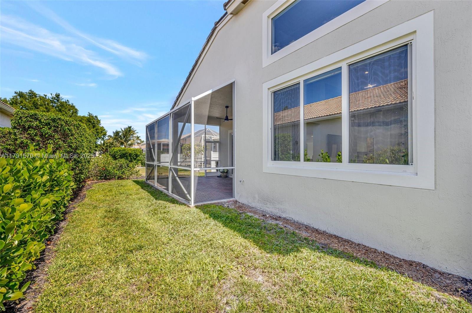 6393 Brava Way Boca Raton, FL 33433 - Photo 41 of 55 a view of an house with backyard and garden