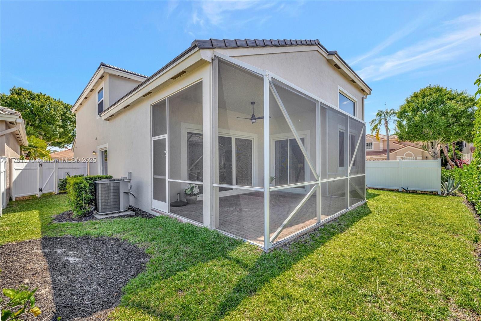 6393 Brava Way Boca Raton, FL 33433 - Photo 45 of 55 a barn house with a big yard and wooden fence