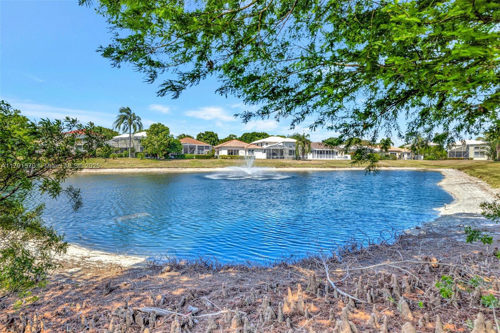 6393 Brava Way Boca Raton, FL 33433 - Photo 48 of 55 a view of a swimming pool with an outdoor space and seating area