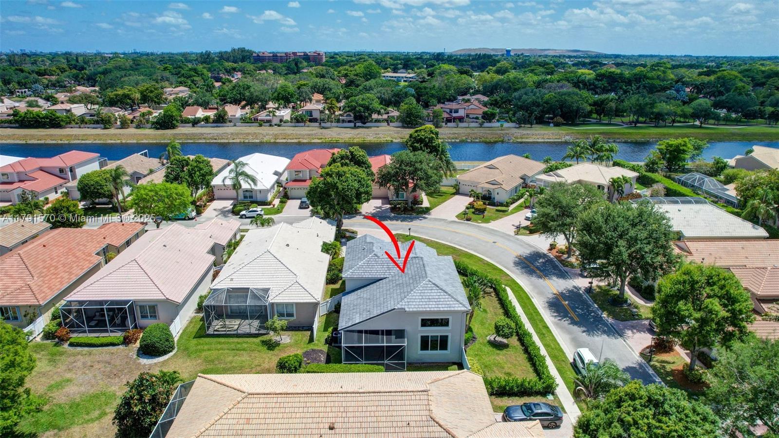 6393 Brava Way Boca Raton, FL 33433 - Photo 49 of 55 a aerial view of a house with a yard and lake view