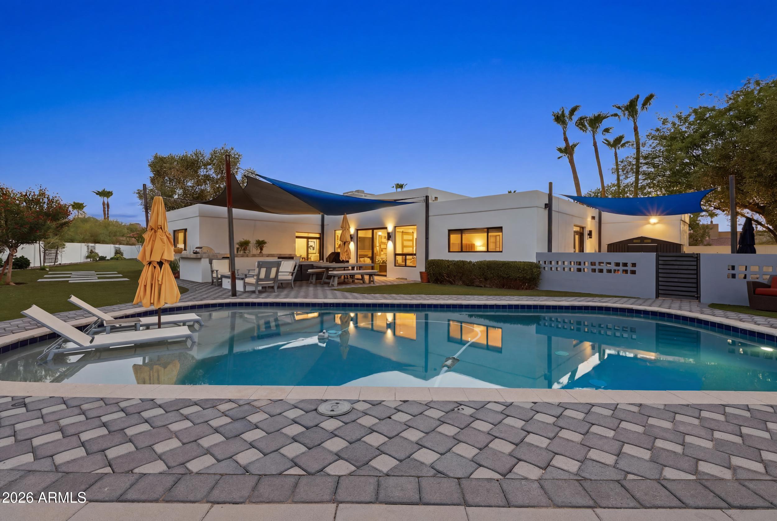 4417 East Mountain View Road Phoenix, AZ 85028 - Photo 29 of 41 a view of a house with pool and chairs