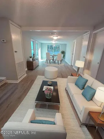 a living room with furniture and a table