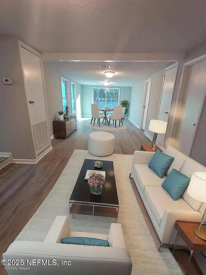 a living room with furniture and a table