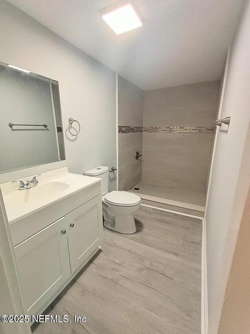 9420 Joos Road Jacksonville, FL 32220 - Photo 7 of 9 a bathroom with a sink a toilet and shower