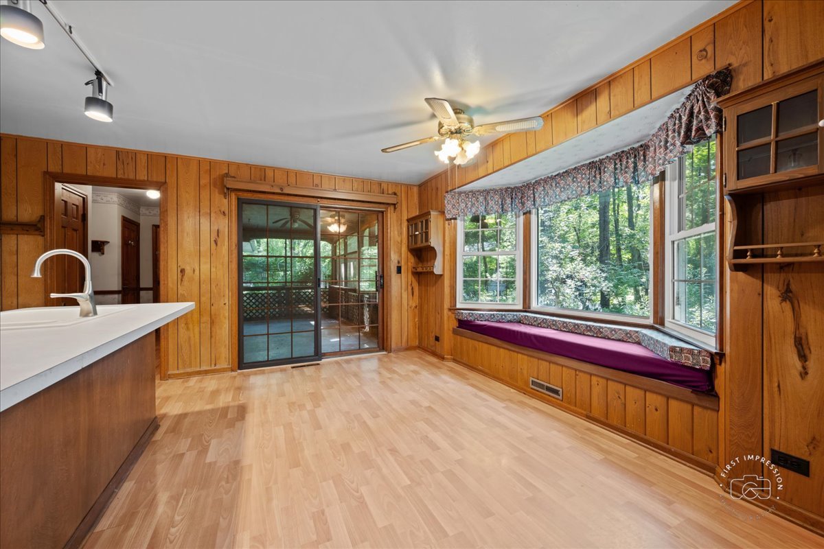 6N400 Old Homestead Road St. Charles, IL 60175 - Photo 11 of 32 a large room with a large window and furniture
