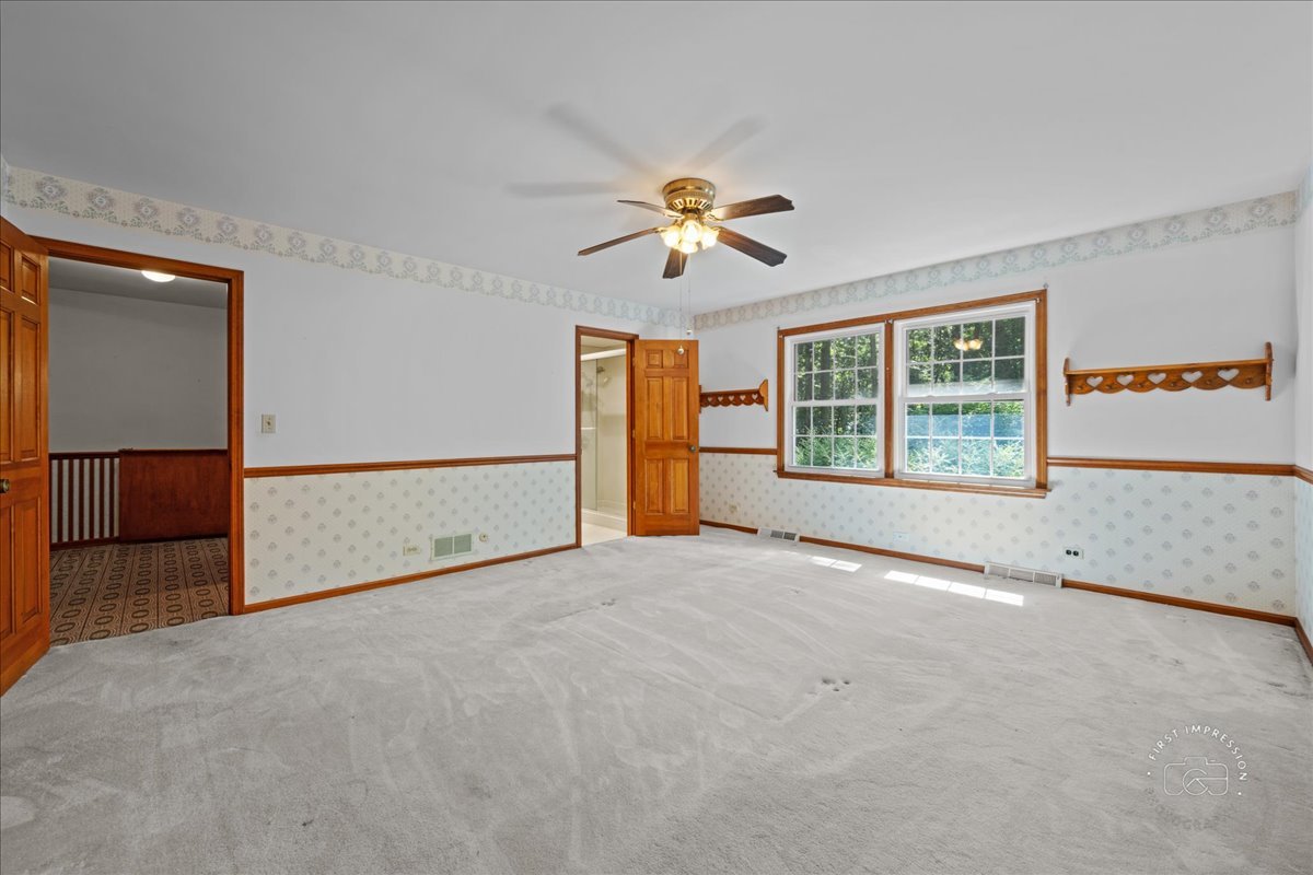 6N400 Old Homestead Road St. Charles, IL 60175 - Photo 20 of 32 an empty room with windows and chandelier fan