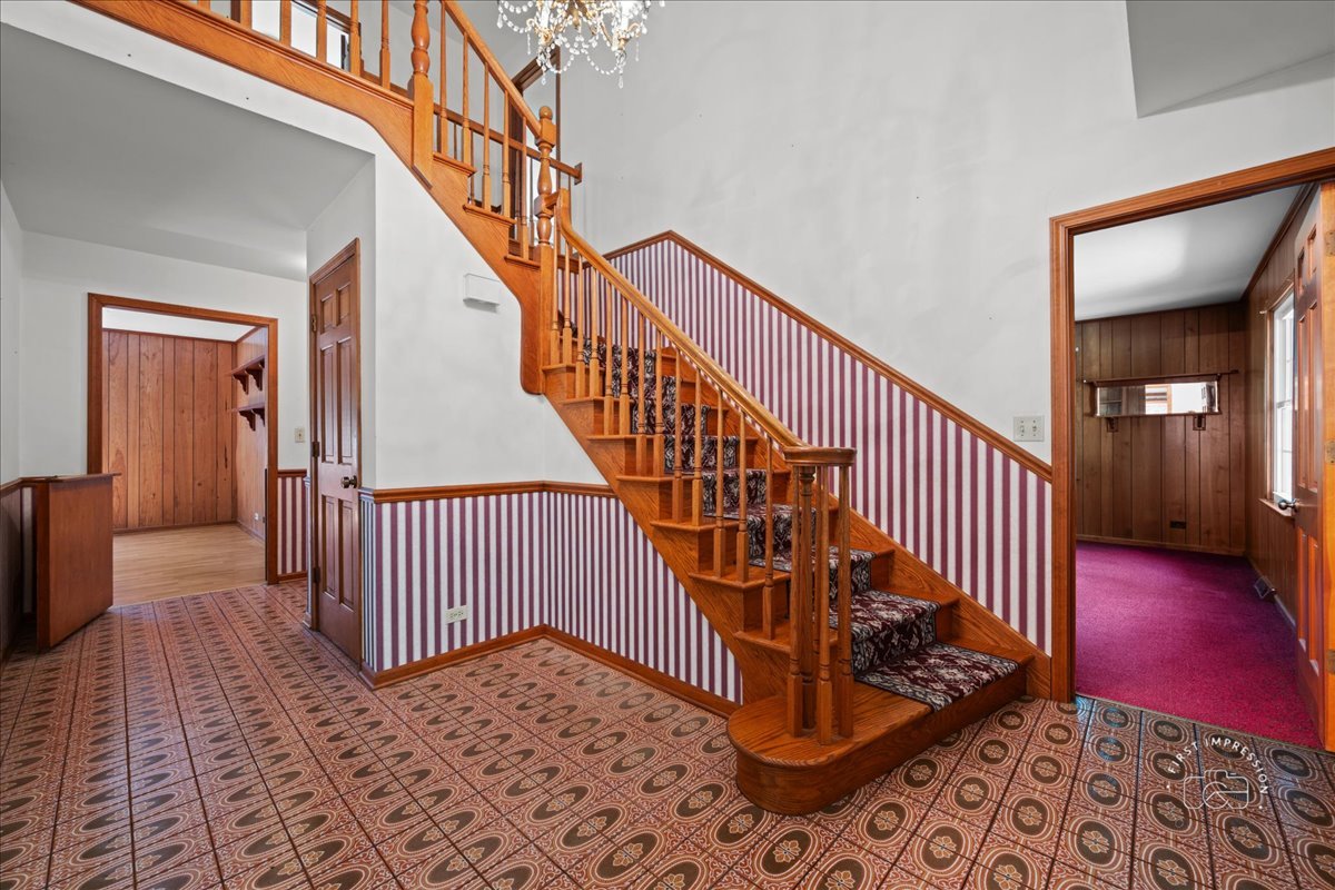 6N400 Old Homestead Road St. Charles, IL 60175 - Photo 5 of 32 a view of entryway with wooden floor and stairs