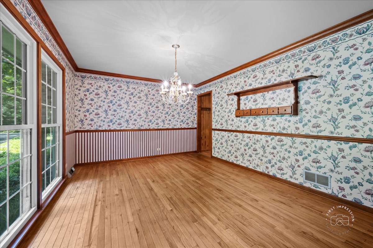 6N400 Old Homestead Road St. Charles, IL 60175 - Photo 8 of 32 a view of a room with wooden floor chandelier and windows