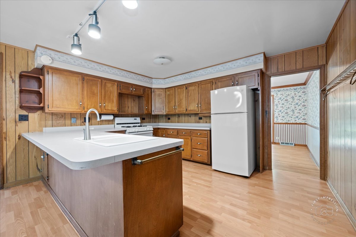 6N400 Old Homestead Road St. Charles, IL 60175 - Photo 10 of 32 a kitchen with kitchen island a sink appliances and cabinets