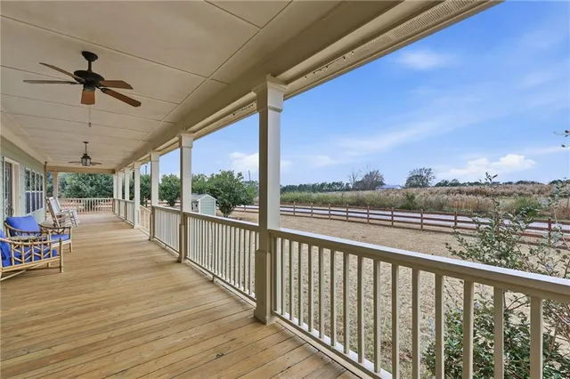 a view of a livingroom with furniture window and wooden floor