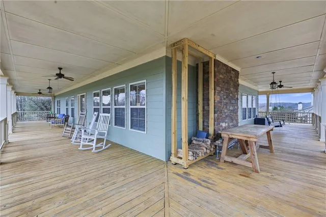 a view of a roof deck with furniture