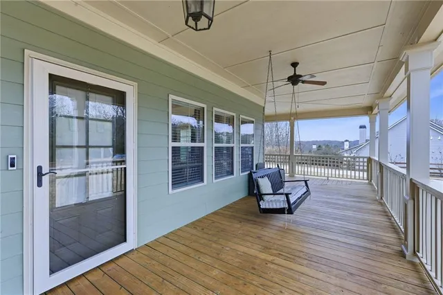 a view of a house with a small deck