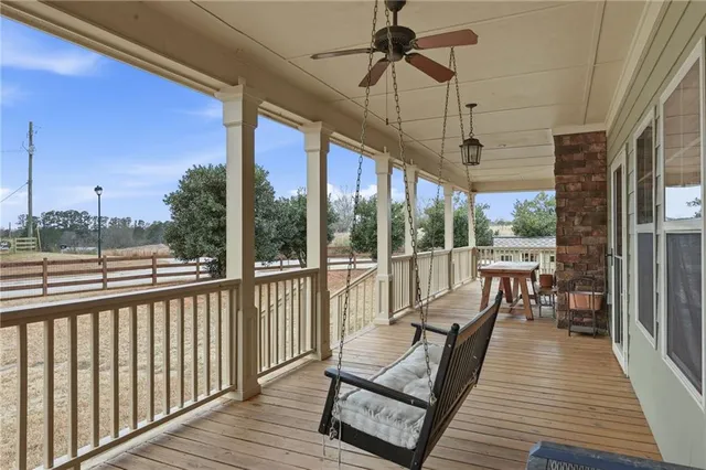 a view of a house with a wooden deck