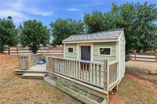 a view of a dining room with furniture wooden floor and chandelier