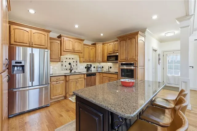 a utility room with cabinets washer and dryer