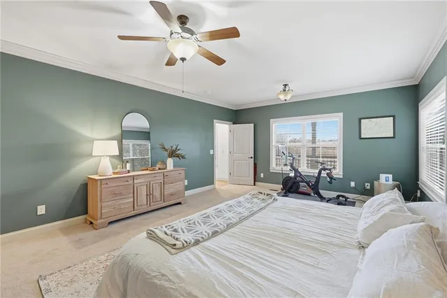 a bedroom with two beds and a chandelier