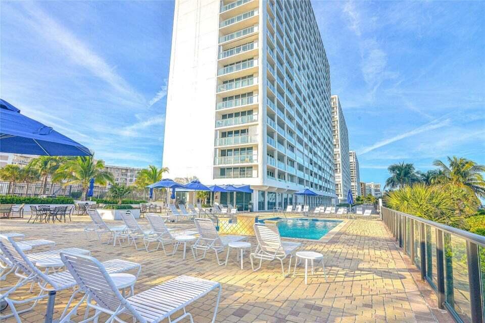 2800 South Ocean Boulevard, Unit 5J Boca Raton, FL 33432 - Photo 53 of 56 a building outdoor space with swimming pool and sitting space