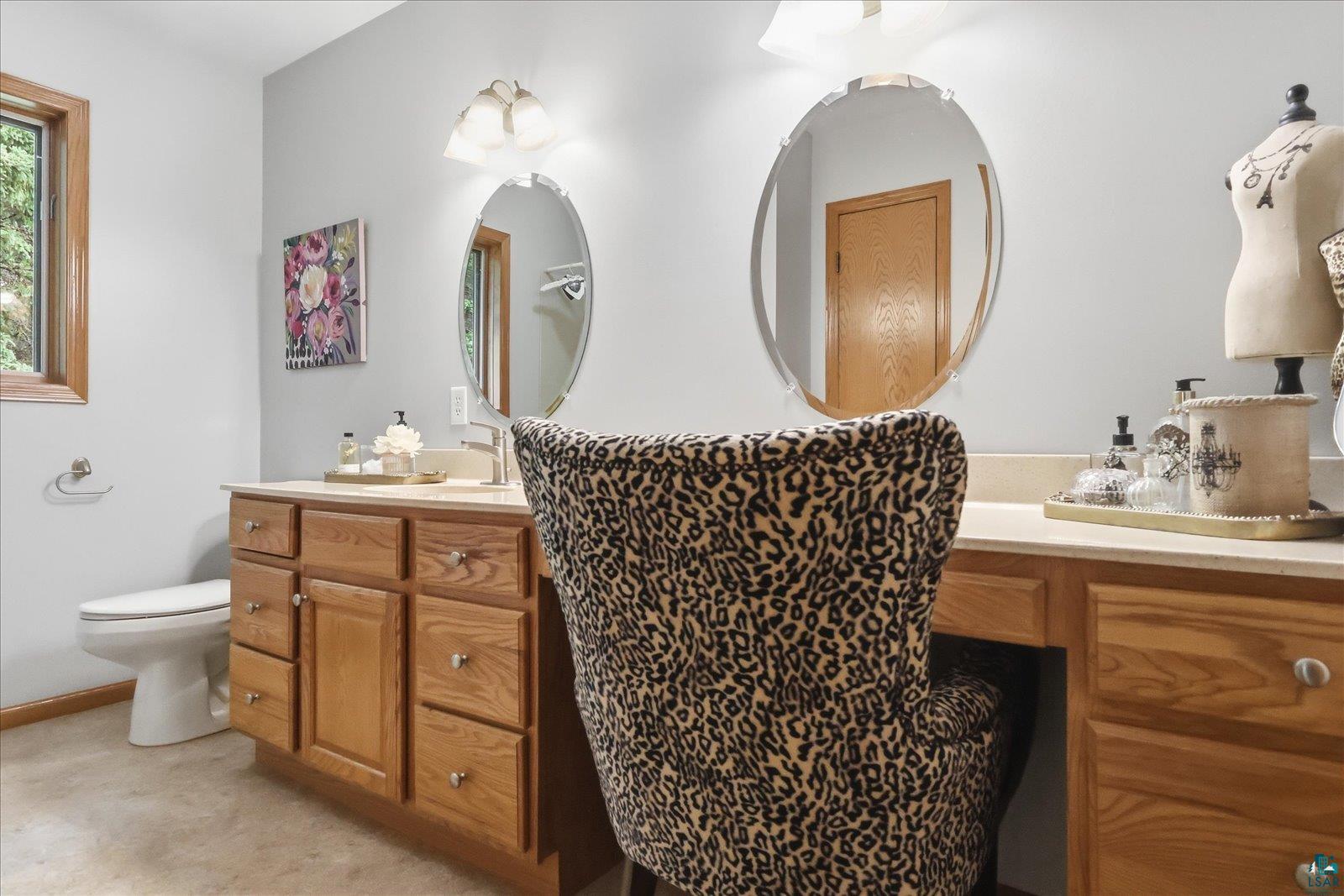 41 East Stark Road Esko, MN 55733 - Photo 11 of 19 Dual vanity with wood cabinetry and light-toned countertops