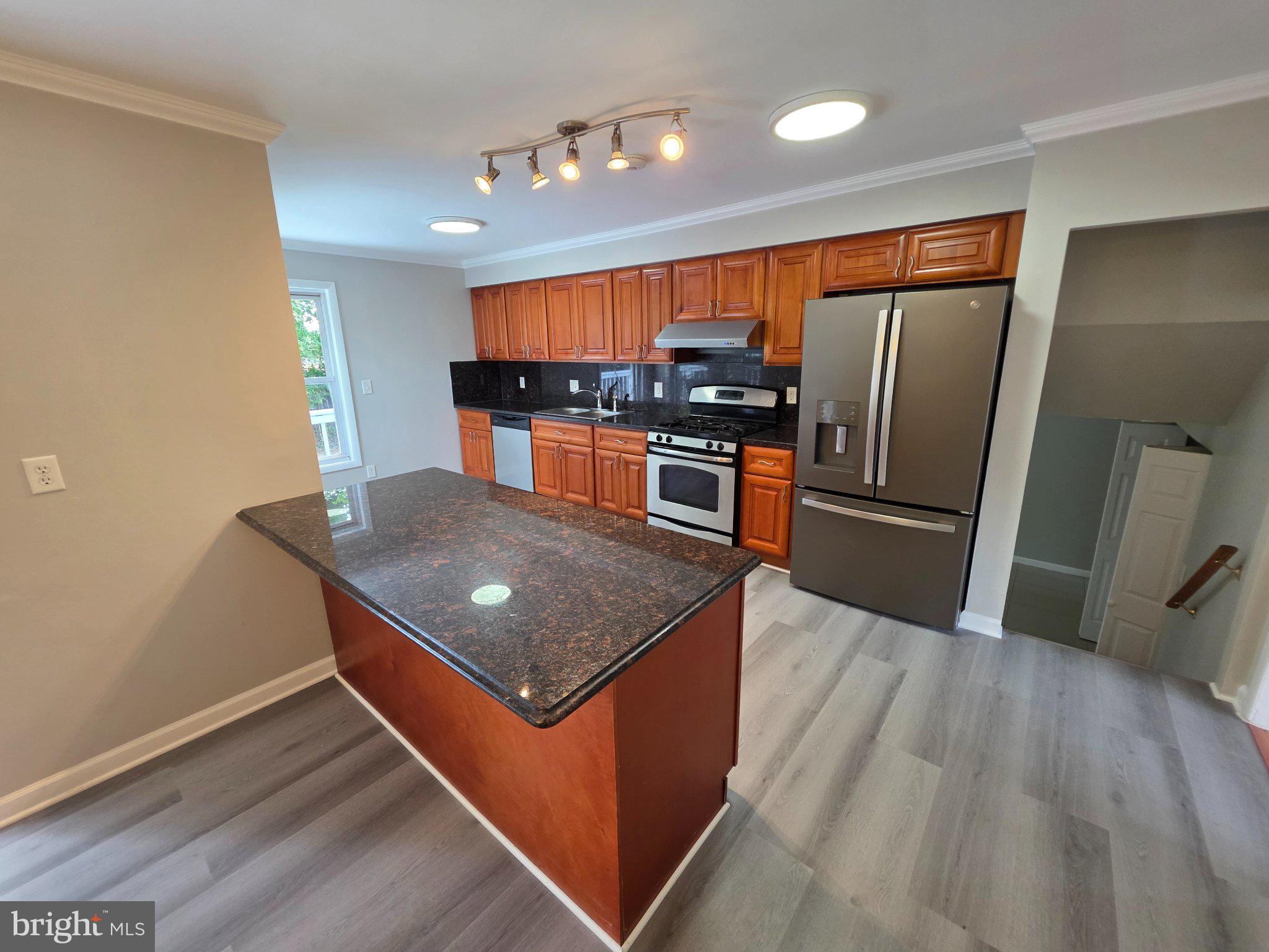 5915 Charnwood Road Catonsville, MD 21228 - Photo 5 of 21 Modern kitchen with sleek finishes.