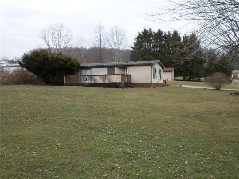 243 Country Club Road Waynesburg, PA 15370 - Photo 1 of 23 Exterior Front. A PLACE TO CALL YOUR OWN - This 3 bedroom, 2 bath manufactured double wide home is on 1/2 an acre of level land in convenient location in Morgan Township with spacious front yard lined with beautiful trees and large back yard