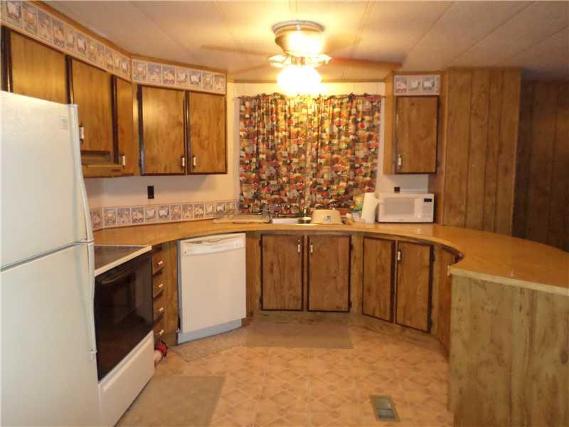 243 Country Club Road Waynesburg, PA 15370 - Photo 5 of 23 Kitchen. Attractive kitchen with curved countertop and lots of cabinetry and breakfast bar