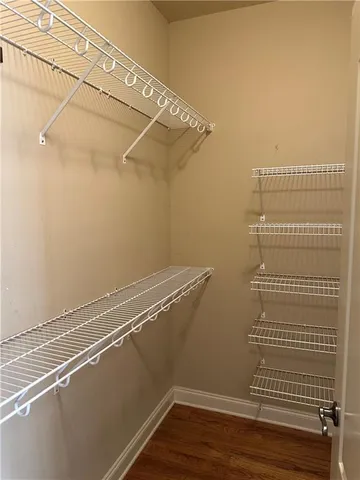 a bathroom with a bathtub and a window