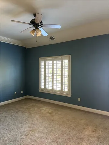 a bathroom with a granite countertop bathtub shower sink vanity and toilet