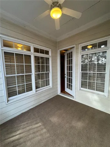 a kitchen with kitchen island granite countertop wooden floor and stainless steel appliances
