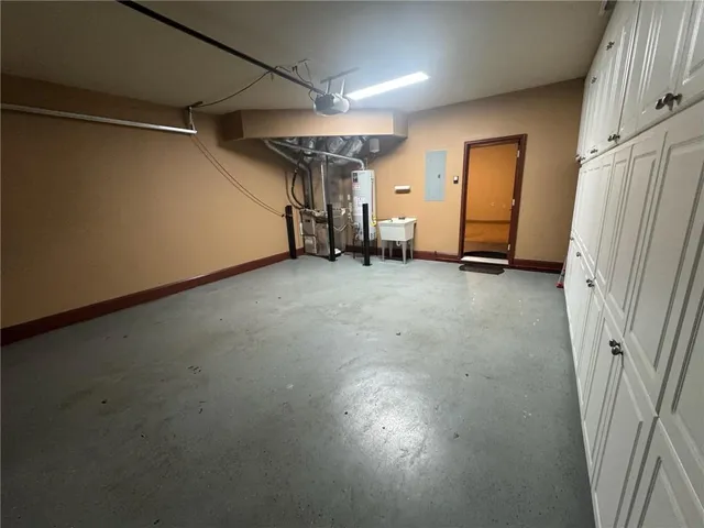 a view of a tree in the backyard of a house