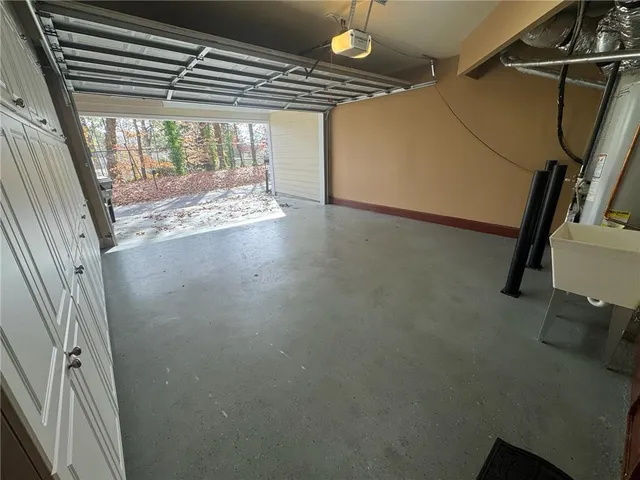 a view of a street with a house in the background