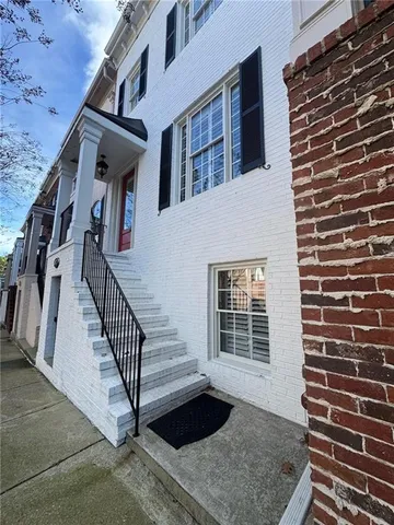 a view of a street with houses on both side