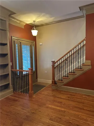 a view of entryway with wooden floor