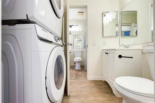 a bathroom with a toilet and a mirror