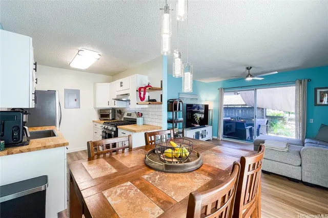 a living room with fireplace furniture and a wooden floor