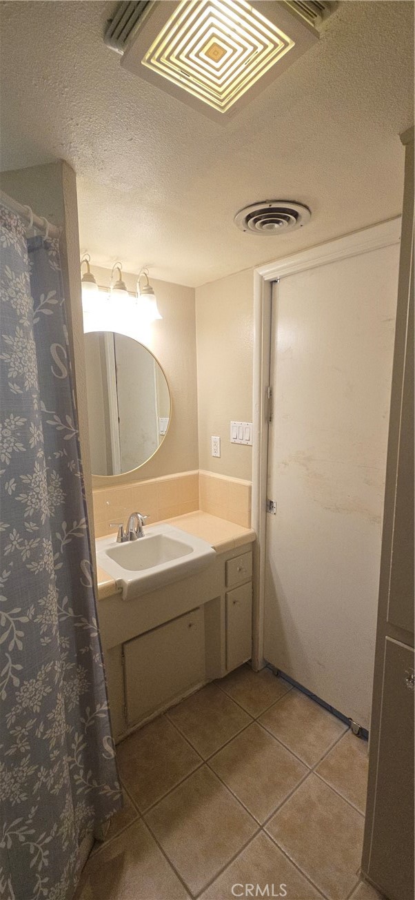 44470 San Pablo Avenue Palm Desert, CA 92260 - Photo 11 of 17 a bathroom with a tub sink shower and mirror