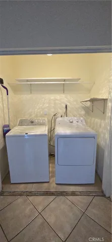 a swimming pool with outdoor seating and yard