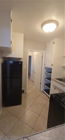 a view of hallway with stairs and a couch