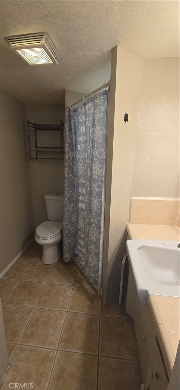 44470 San Pablo Avenue Palm Desert, CA 92260 - Photo 10 of 17 a bathroom with a toilet and a shower