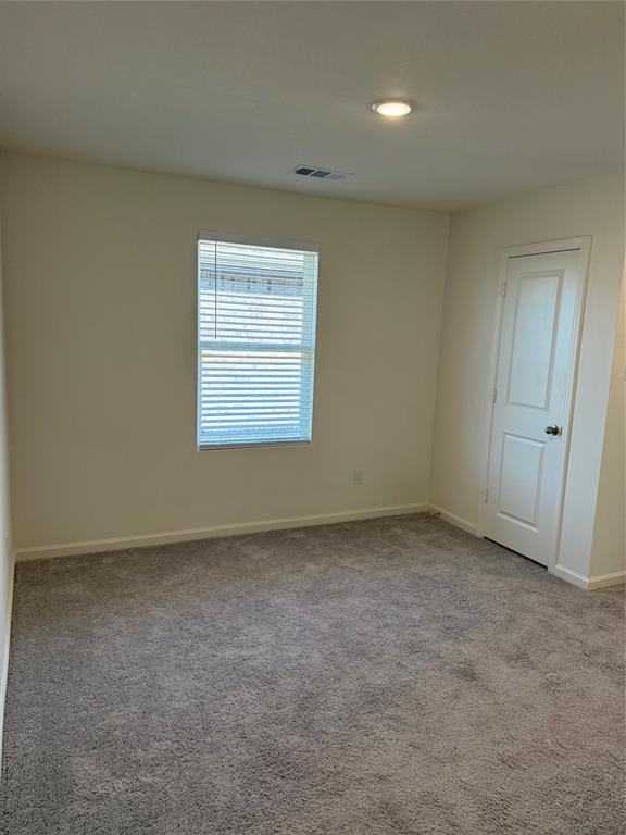 2104 Jackson Street Princeton, TX 75407 - Photo 11 of 15 an empty room with a window