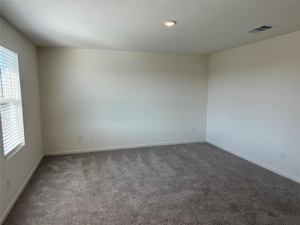 2104 Jackson Street Princeton, TX 75407 - Photo 12 of 15 an empty room with a window